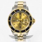 Rolex Submariner Stainless Steel and Yellow Gold Champagne Diamond and Sapphire Serti Dial Black Bezel Automatic Watch 16613